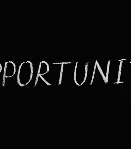 Word 'Opportunity' written in chalk on a black chalkboard, symbolizing new possibilities.